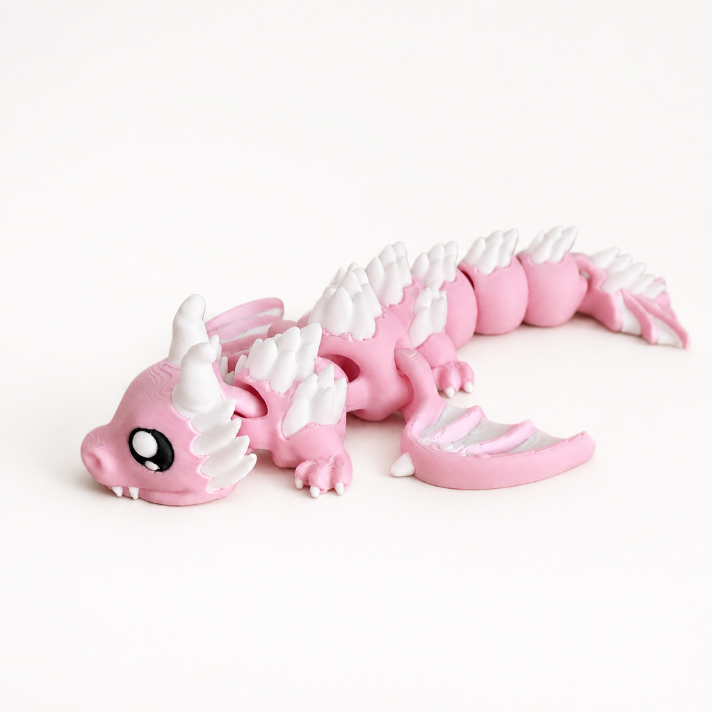 Blyss Rosa – beweglicher 3D-gedruckter Drache in rosa und weiß vor hellem Studiohintergrund, Produktfoto