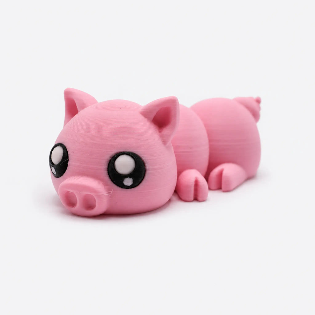 Rosalie – bewegliches 3D-gedrucktes Schweinchen in Rosa vor hellem Studiohintergrund